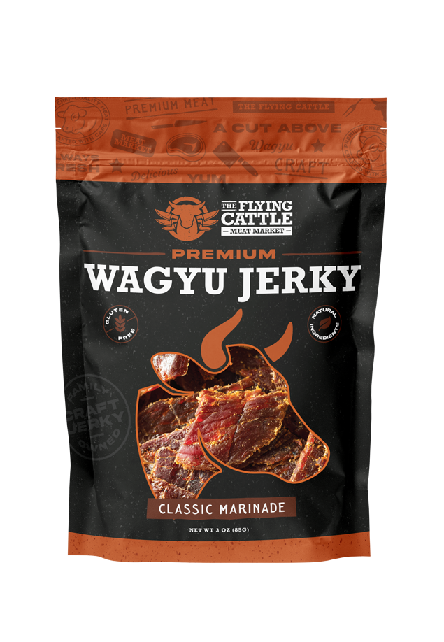 A 3 oz bag of The Flying Cattle Premium Wagyu Jerky in Classic Marinade, featuring a black and orange design with a graphic of marinated beef slices.